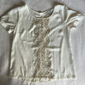 Off-white Blouse with gold lace and button-down back.